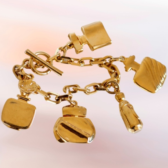Vintage 1980's ESTEE LAUDER Gold Tone Toggle Charm Bracelet - Picture 1 of 4